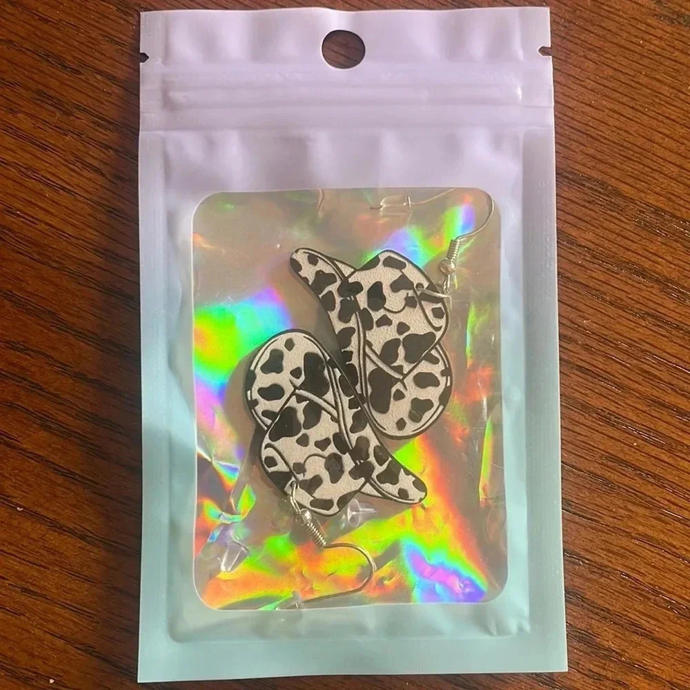 Cowprint Cowboy Hat Earringsβ